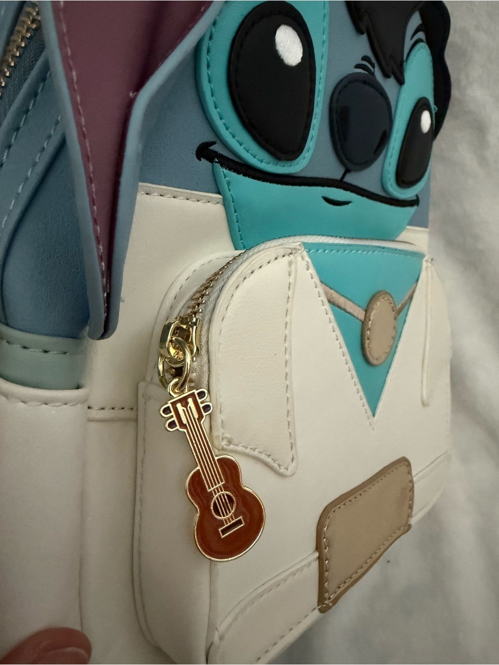 Disney Blue, White and Teal Stitch Backpack with Gold Guitar Charm